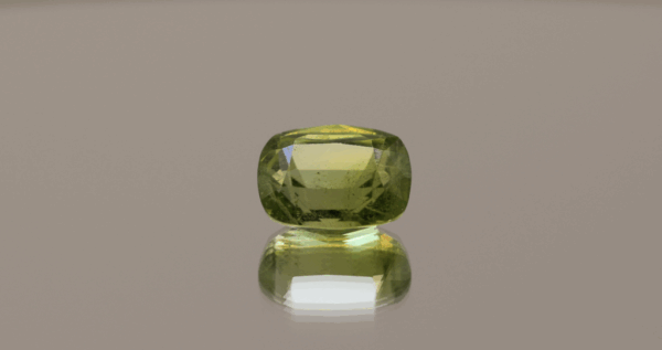 Natural 4.71 ct peridot in cushion cut, yellowish green color, untreated, loose gemstone, dimensions 11 × 8.4 × 6.3 mm, perfect for fine jewelry.