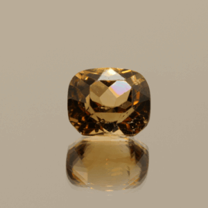 Light brown cushion-shaped topaz, 4.73 carat, 9.6 × 8.3 × 6.6 mm, no treatment, unknown origin.