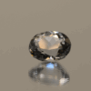 Natural oval cut aquamarine gemstone with colorless hue, 11.4 × 10.2 mm