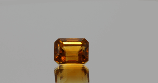 Natural octagon cut citrine gemstone with yellow-orange color, 10.4 × 8 mm