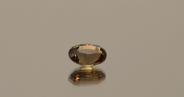 Padparadscha Sapphire. Brownish orange pink oval-shaped sapphire (Padparadscha), 1.58 carat, 7.73 × 5.80 × 3.90 mm, no treatment, Madagascar origin, GFCO certified.