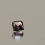 Natural sapphire gemstone, 0.79 carat, cushion cut, orange-pink color, padparadscha, unheated, loose gemstone, dimensions 4.85 × 4.73 × 3.71 mm, origin Madagascar, AIG certified.