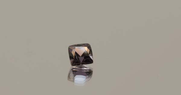 Natural sapphire gemstone, 0.79 carat, cushion cut, orange-pink color, padparadscha, unheated, loose gemstone, dimensions 4.85 × 4.73 × 3.71 mm, origin Madagascar, AIG certified.