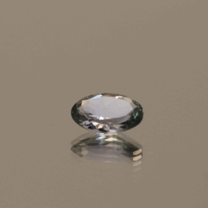 Violet green oval-shaped tanzanite, 0.58 carat, 6.95 × 4.9 × 2.52 mm, no treatment, unknown origin, GIA certified.