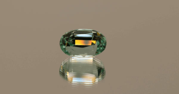 Light green cushion-shaped spodumene, 6.45 carat, 12.5 × 8.1 × 8.5 mm, no treatment, unknown origin.