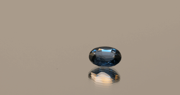 Deep blue oval-shaped color change spinel, 1.18 carat, 7.39 × 5.71 × 3.32 mm, no treatment, unknown origin, ALGT certified.