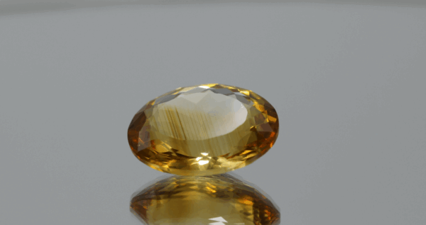 Natural oval cut citrine gemstone with yellow-orange color, 16.80 × 13.10 mm Title: