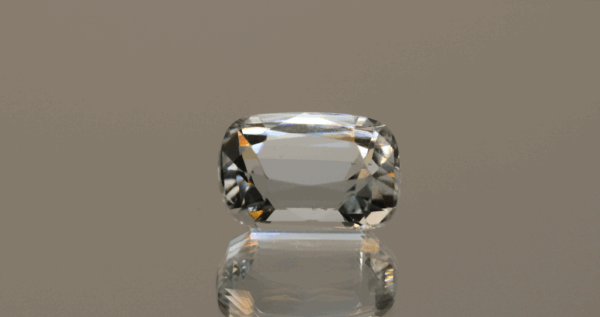 Natural cushion cut aquamarine gemstone with colorless hue, 14.14 × 10.00 mm