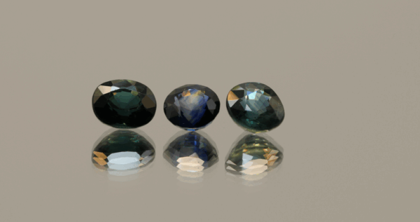 Set of 3 blue-green round Thailand sapphire, 0.89 carat total, 5.69 × 5.28 × 3.54 mm each, heat-treated, Thailand origin, GFCO certified.