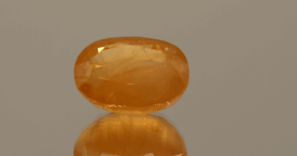 Natural Hackmanite gemstone, 8.81 ct, orange oval, untreated, certified AIG GEM20231110104163
