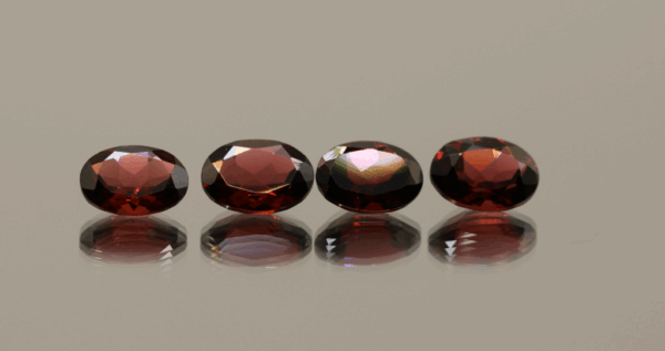 Set of 4 natural almandine garnets, 5.65 carats total, oval cut, purple-red color, untreated