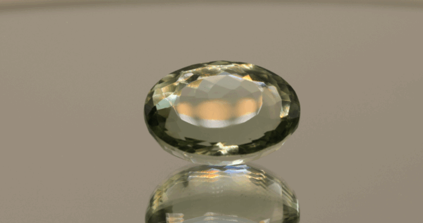 Natural prasiolite gemstone, 14.5 carat, oval cut, pale green color, untreated, loose gemstone, dimensions 18.4 × 13.7 × 8.5 mm, ideal for fine jewelry.