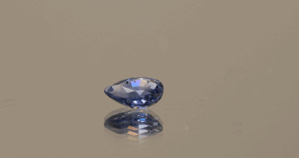 Blue sapphire 0.89 carat pear cut, heat-treated, Sri Lanka origin, dimensions 6.82 × 5.4 × 2.95 mm, AIG certified.