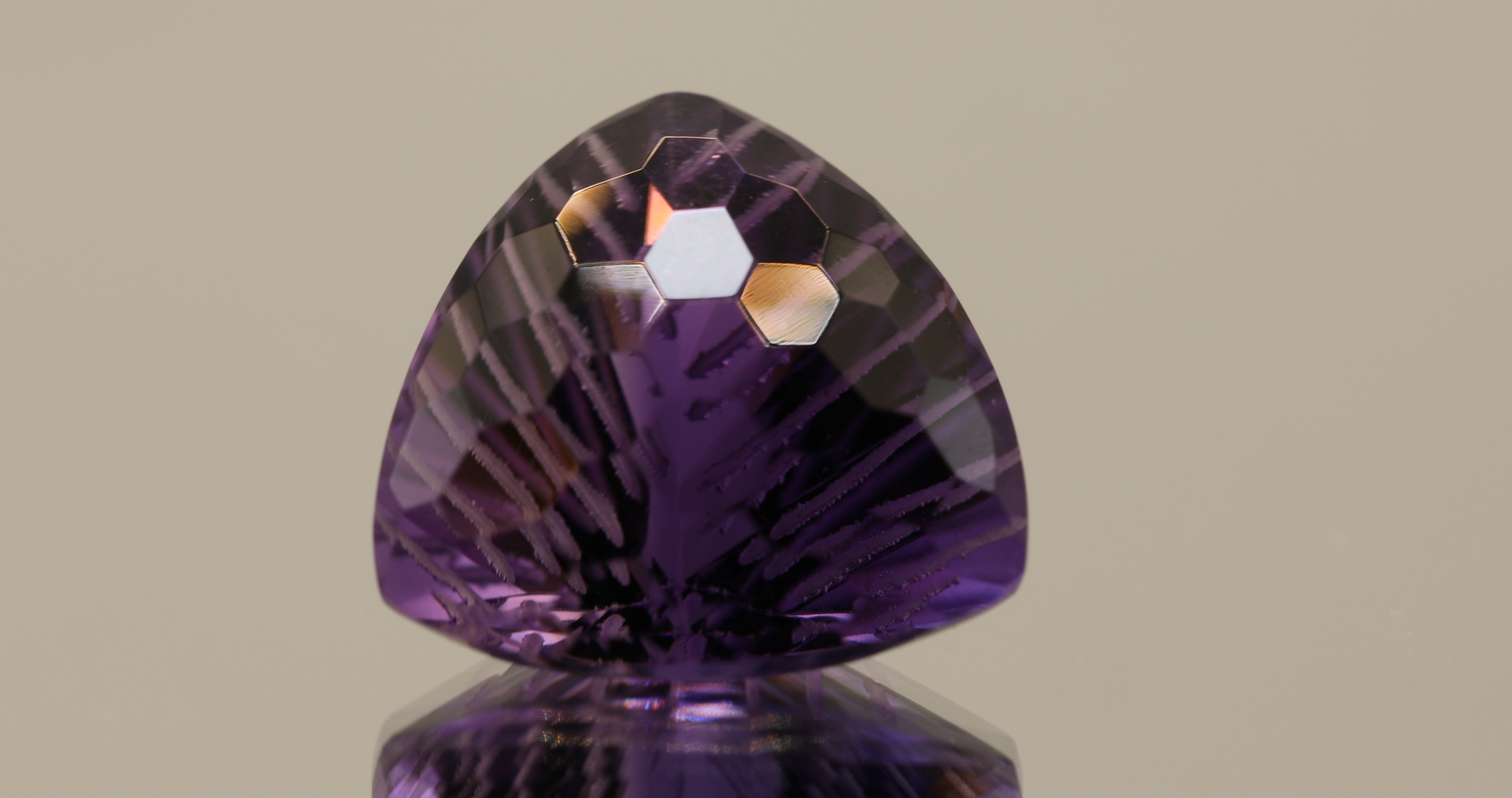 Natural trillion cut amethyst gemstone with purple violet color, 16.30 × 15.90 mm