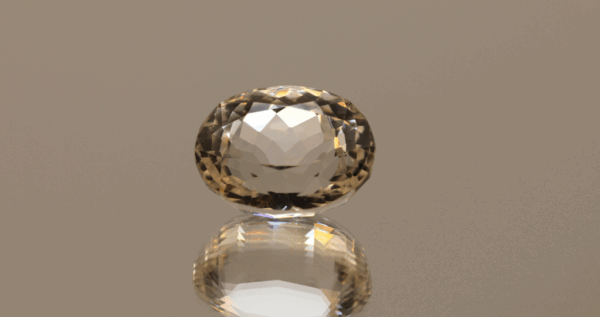Light yellow oval-shaped spodumene, 9.65 carat, 13.6 × 10.7 × 8.6 mm, no treatment, unknown origin.