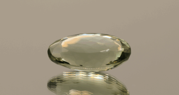 Natural prasiolite gemstone, 12.58 carat, oval cut, pale green color, untreated, loose gemstone, dimensions 20.5 × 12.1 × 7.7 mm, ideal for fine jewelry.