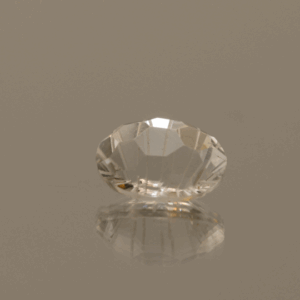 Faceted Topaz gemstone, colorless, oval cut, 3.78 carats, high clarity, ideal for fine jewelry.