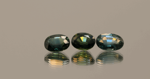 Set of three green-blue sapphires 2.83 carat total, oval cut, heat-treated, Madagascar Sapphire origin, dimensions 7.09 × 5.15 × 3.01 mm, GFCO certified.