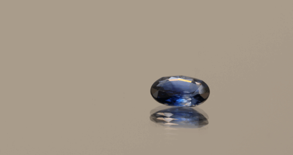 Natural sapphire gemstone, 0.72 carat, oval cut, royal blue color, heat-treated, loose gemstone, dimensions 6.73 × 4.95 × 2.29 mm, origin Madagascar, IGS certified.