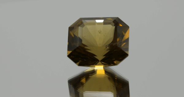 Natural octagon cut citrine gemstone with yellow-orange color, 16.3 × 15.1 mm