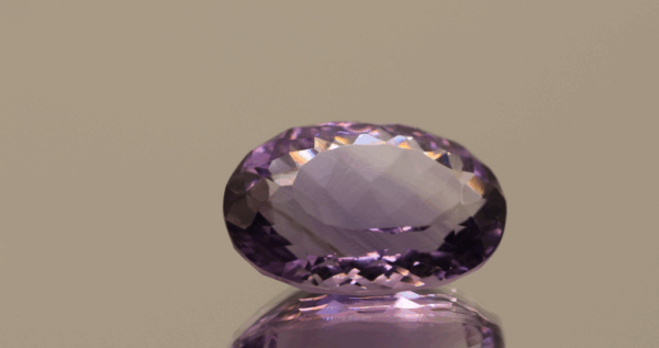 Natural oval cut amethyst gemstone with purple violet color, 15.40 × 11.50 mm