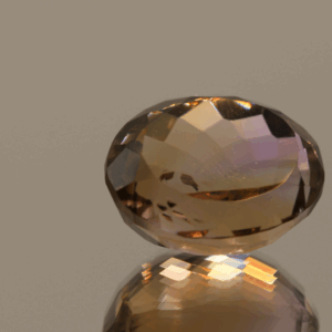Natural oval cut ametrine gemstone with purple yellow color, 15.30 × 12.40 mm