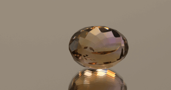 Natural oval cut ametrine gemstone with purple yellow color, 15.30 × 12.40 mm