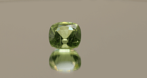 Natural 6 ct peridot, cushion cut, yellow green color, untreated, loose gemstone, dimensions 10.5 × 9.8 × 7.6 mm, perfect for fine jewelry.