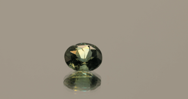 Teal sapphire gemstone 1.19 carat oval cut, untreated, Sri Lanka origin, dimensions 6.66 × 5.9 × 3.9 mm, GFCO certified.
