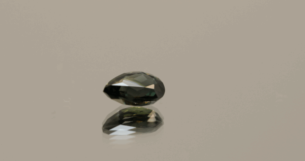 Greenish blue to purplish red pear-shaped color change sapphire, 1.32 carat, 7.93 × 5.56 × 3.33 mm, no treatment, Madagascar origin, AIG certified.