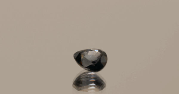 Green blue sapphire gemstone 1.02 carat pear cut, heat treated, Madagascar origin, dimensions 6.19 × 5.38 × 3.62 mm, GFCO certified.