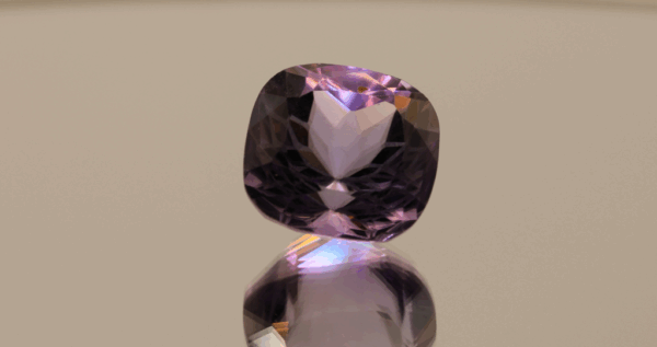 Natural cushion cut amethyst gemstone with purple violet color, 14.9 × 14.3 mm