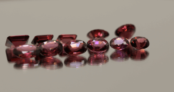 Natural rhodolite garnet gemstones 13.5 carats mixed cuts purple color untreated loose stones set