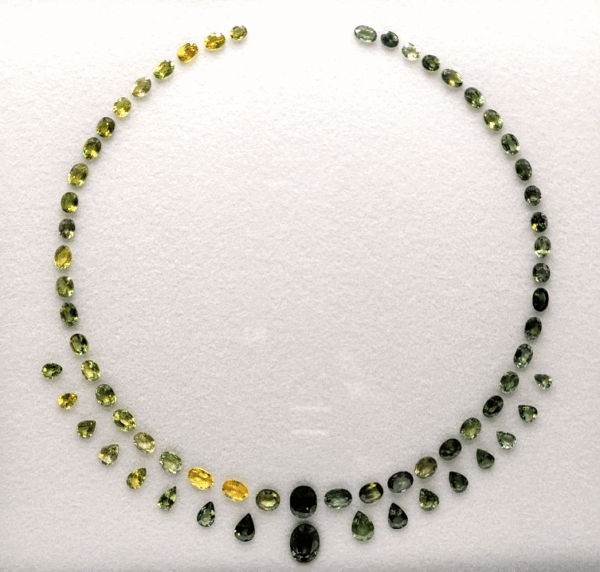 Greenish Yellow Sapphire Necklace Set with 65 natural sapphires totaling 50 carats in oval and pear cuts